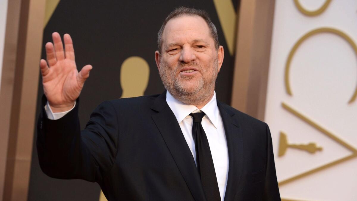 Harvey Weinstein at the Oscars in 2014. He has resigned from the board of Weinstein Co., which he co-founded with his brother, Bob.