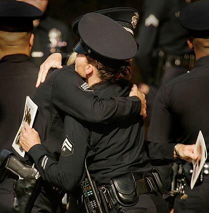 LAPD funeral - hug