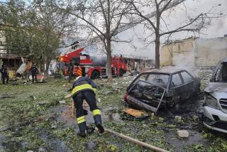 In this photo provided by the Ukrainian Emergency Service, emergency services personnel work to extinguish a fire following a Russian attack in Cherkasy, Ukraine, Thursday, Sept. 21, 2023. (Ukrainian Emergency Service via AP)