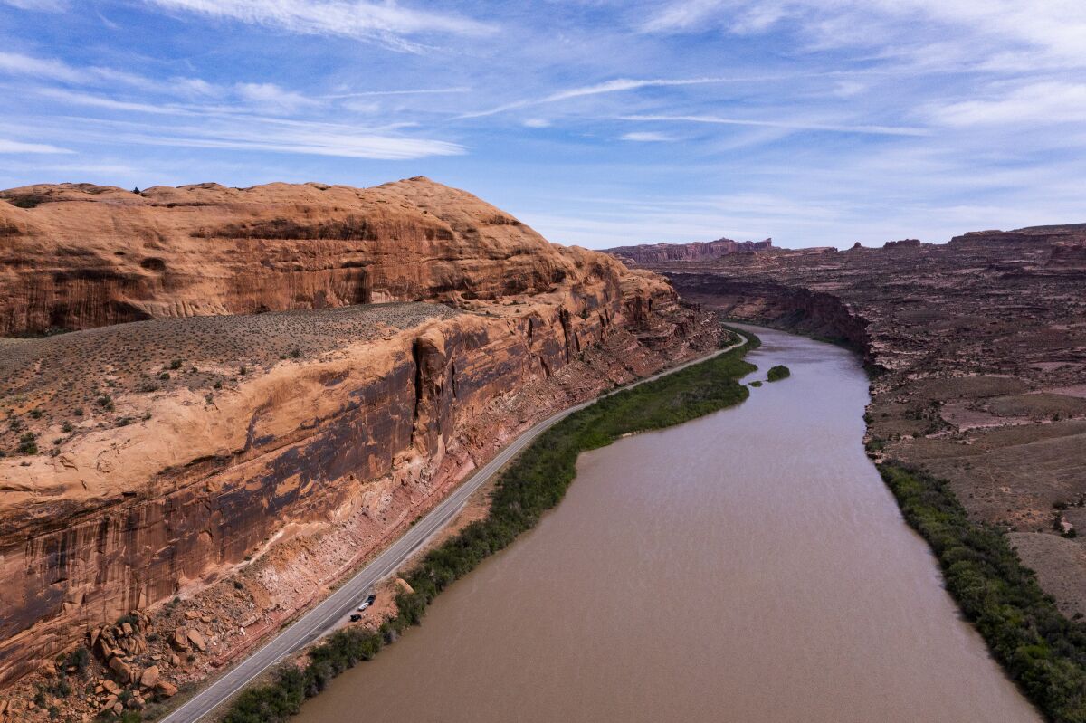 Colorado river bordered with rocky canyons