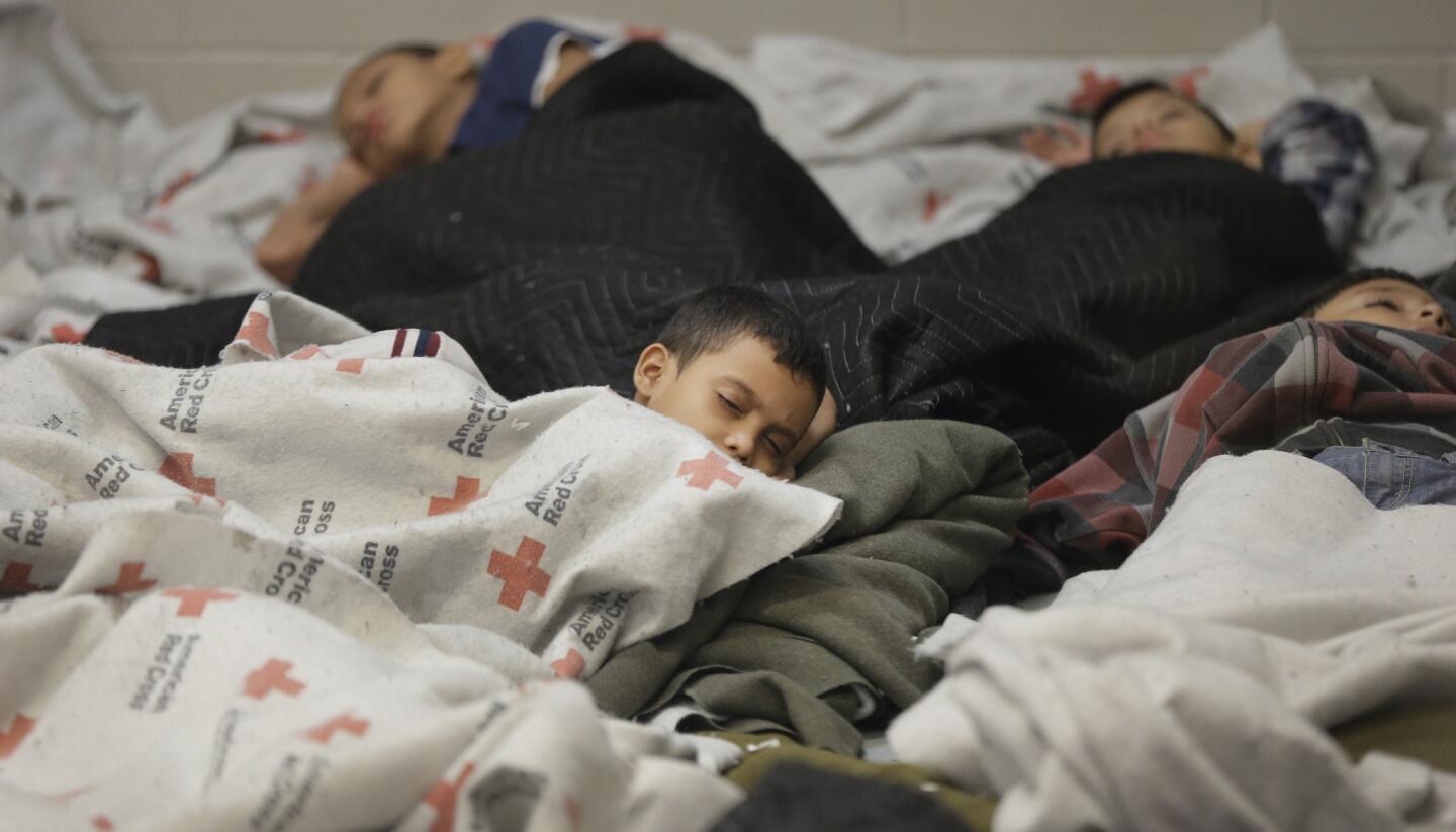 Detainees sleep in a holding cell at a U.S. Customs and Border Protection processing facility in Brownsville, Texas.