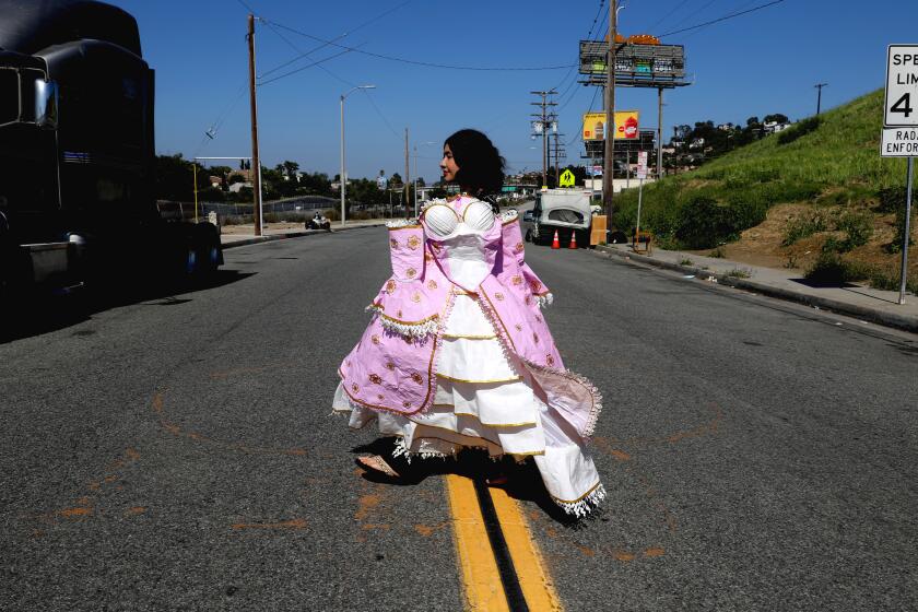 LOS ANGELES, CA - JULY 07: Karla (cq) Torres (cq), 18, of Los Angeles, is a finalist in the Stuck At Prom, a duct tape scholarship contest, on Friday, July 7, 2023 in Los Angeles, CA. The contest awards scholarships to high schoolers who make the best prom attire out of Duck Brand Duct tape. Torres will be attending California State University Fullerton pursuing a degree in business marketing starting Aug. 2023. Karla spent 120 hours making the dress. (Gary Coronado / Los Angeles Times)