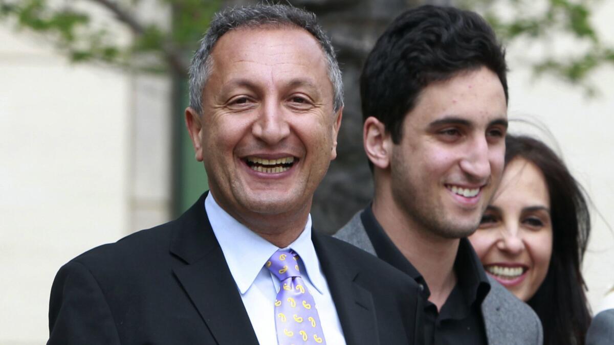 MGA Chief Executive Isaac Larian, left, leaves federal court in Santa Ana in 2011 after a victory over Mattel Inc. in an intellectual property dispute.