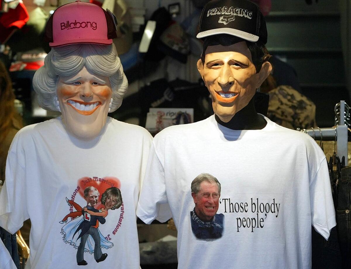 April 4, 2005: T-shirts and masks are sold in Windsor High Street, England, for the marriage of Prince Charles and longtime companion Camilla Parker Bowles. "Those bloody people" refers to a comment the Prince was overheard to make about the media at a recent photocal