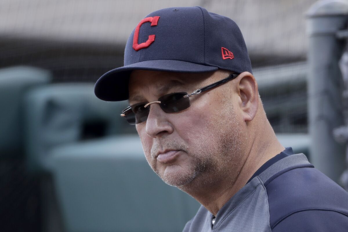 FILE - In this Feb. 23, 2020, file photo, Cleveland Indians manager Terry Francona watches during the fourth inning of a spring training baseball game against the Kansas City Royals in Surprise, Ariz. Francona continues to undergo medical tests for a gastrointestinal issue, and there remains no clear timetable for when he'll return to the team. (AP Photo/Charlie Riedel, File)