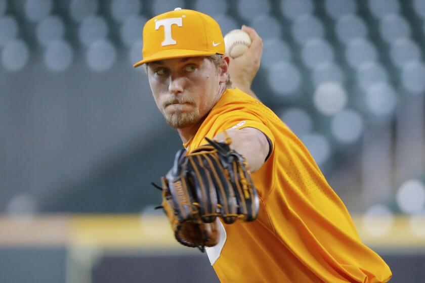 FILE - Tennessee pitcher Ben Joyce throws during an NCAA college baseball game against Oklahoma on Sunday, March 6, 2022, in Houston. Tommy John surgery to fix a ligament inside the elbow has become almost a routine procedure for pitchers. Tennessee right-hander Ben Joyce fared so well that he did much more than just get back on the mound. His fastball got faster.(AP Photo/Michael Wyke, File)