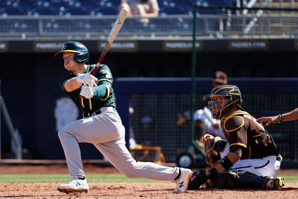 Nick Allen of the Oakland Athletics hits RBI double against the Padres during spring training game on March 18 in Peoria.