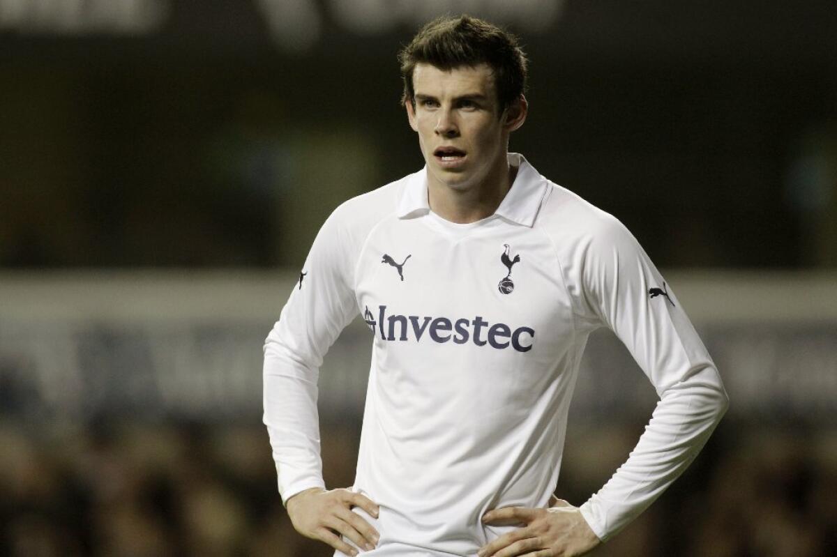Soccer player Gareth Bale puts his hands on his hips during a match