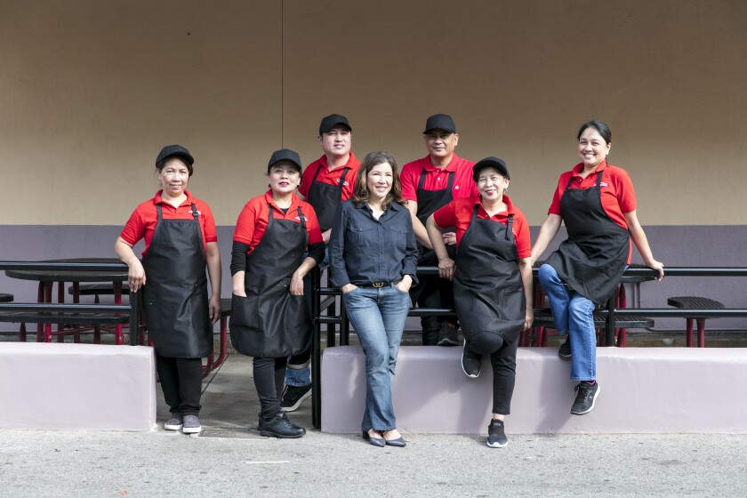 Arko Foods International owner Susie Fong, joined by her staff