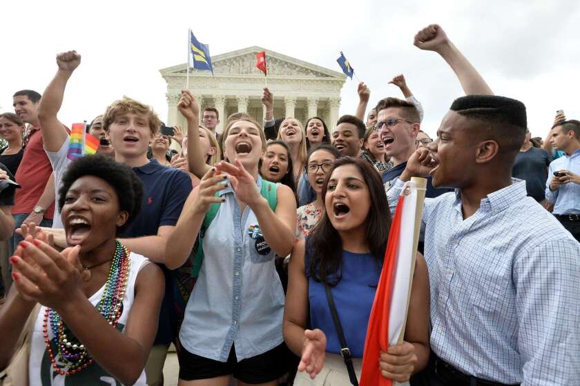 People celebrate outside the Supreme Court on Friday after its historic decision on same-sex marriage.