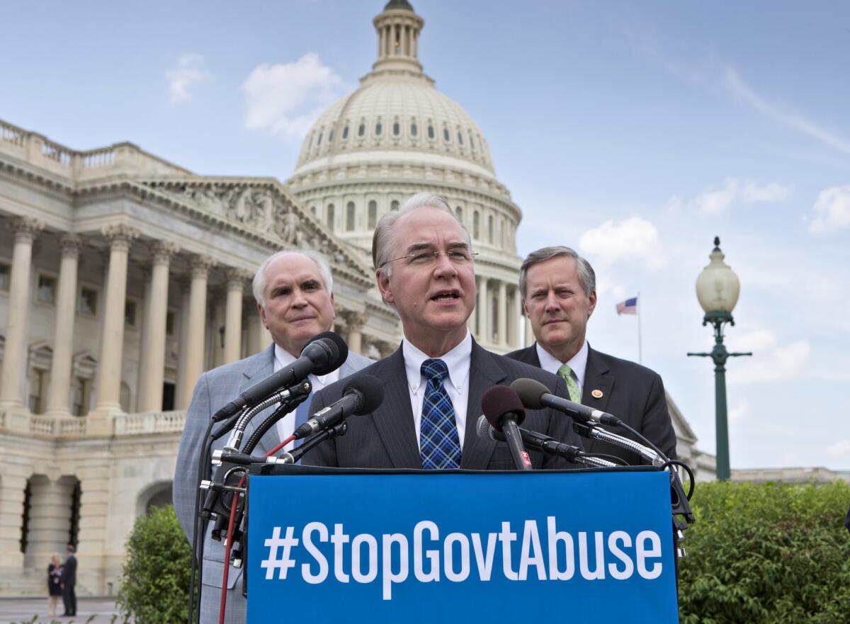 Rep. Tom Price (R-Ga.), center, flanked by Rep. Mike Kelly (R-Pa.), left, and Rep. Mark Meadows (R-N.C.), speaks during a news conference on Capitol Hill on Friday about his bill to effectively eliminate the 2010 healthcare reform law's individual mandate to buy health insurance. It is the 40th time the Republican-controlled House has tried to block or gut the Patient Protection and Affordable Care Act, popularly known as Obamacare.