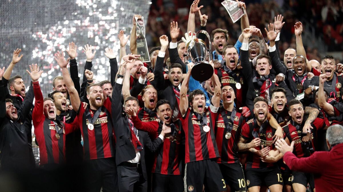 Atlanta United players celebrate after defeating the Portland Timbers 2-0 to win the MLS Cup on Dec. 8.