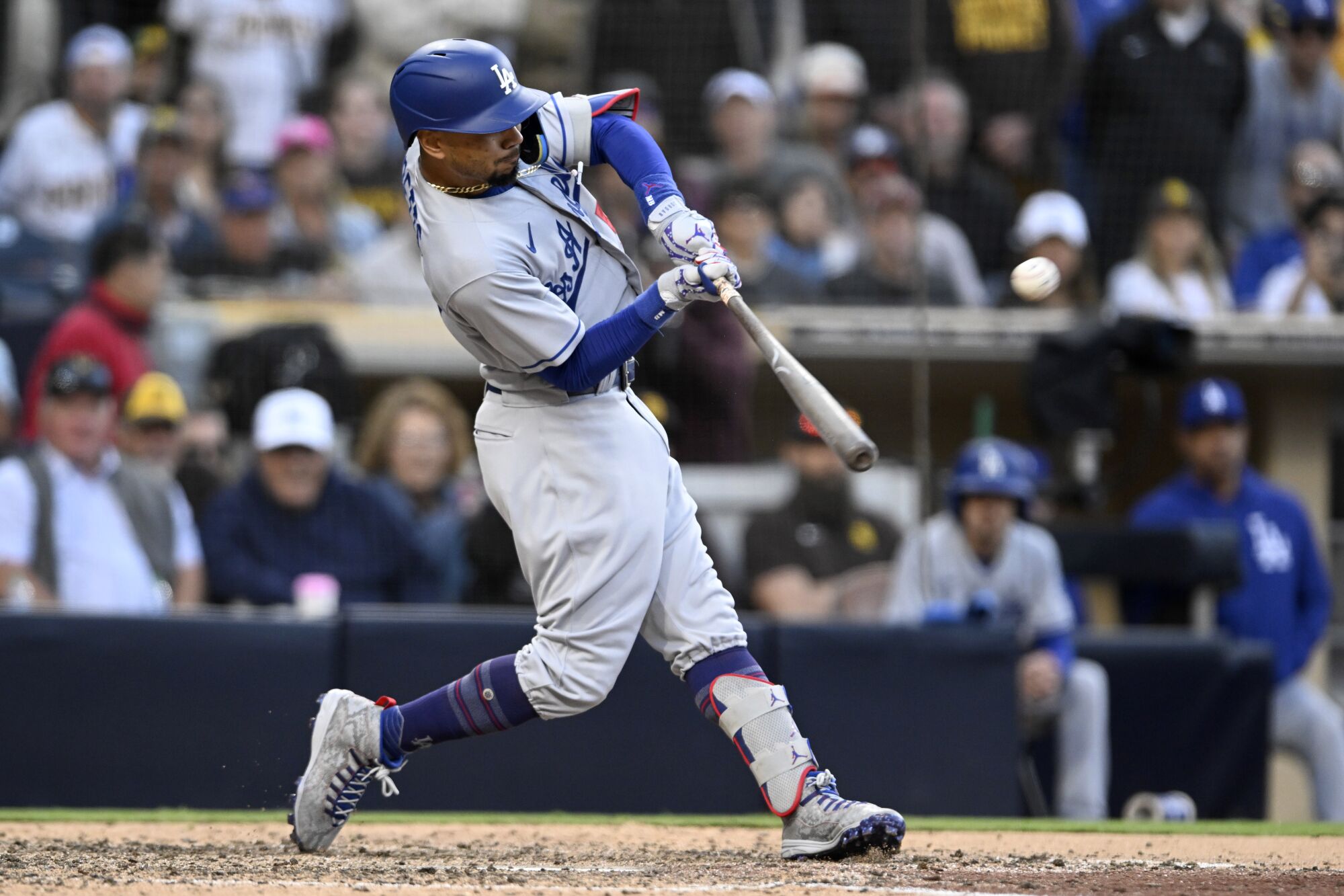 Dodgers' Mookie Betts hits a solo home run against the San Diego Padres on May 7, 2023, in San Diego.
