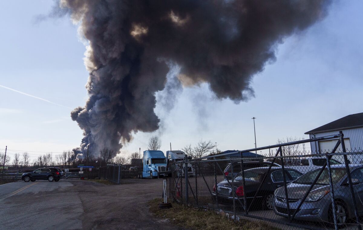 A massive fire burns inside a Walmart distribution center in Plainfield, Ind., near the Indianapolis International Airport, March 16, 2022. The incident has been cited in a baseless conspiracy theory suggesting fires at food processing and other facilities are part of a plot to cause a food shortage in the U.S. (Mykal McEldowney/The Indianapolis Star via AP)