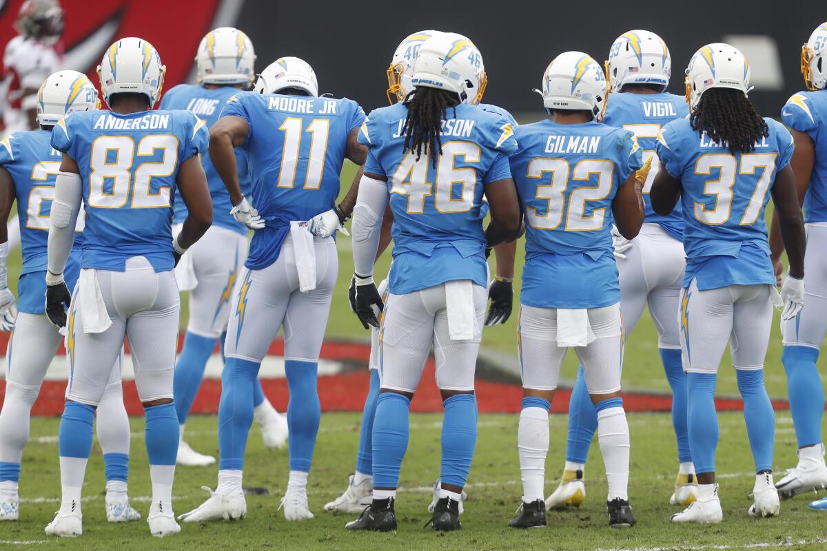 The Chargers huddle during a timeout.