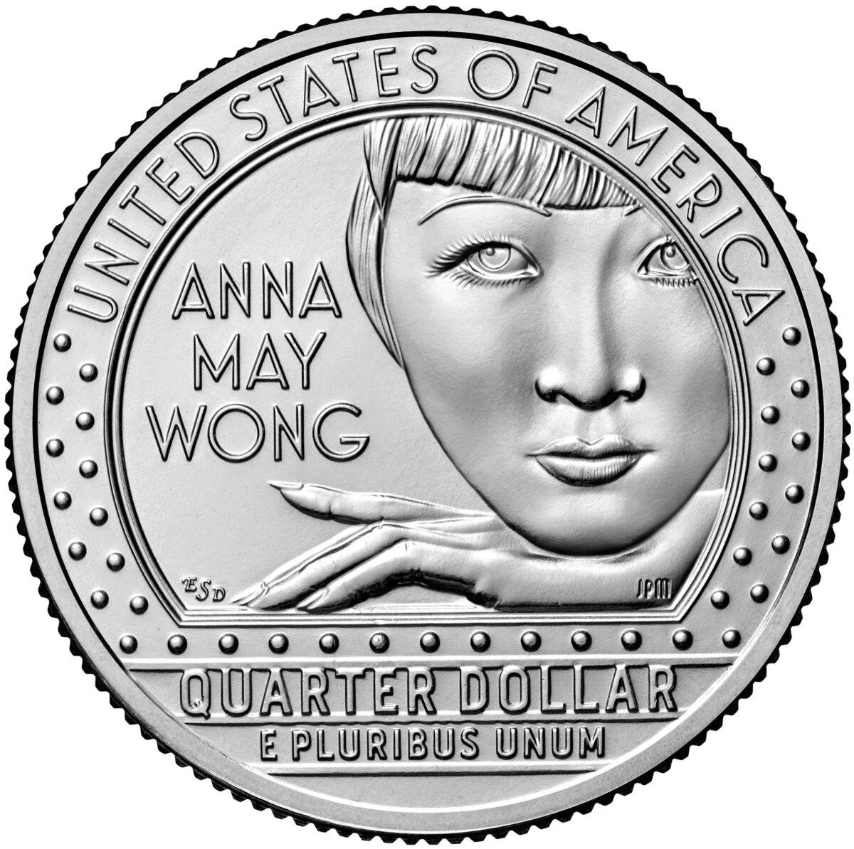 A quarter with Anna May Wong's face, chin and resting hand on it