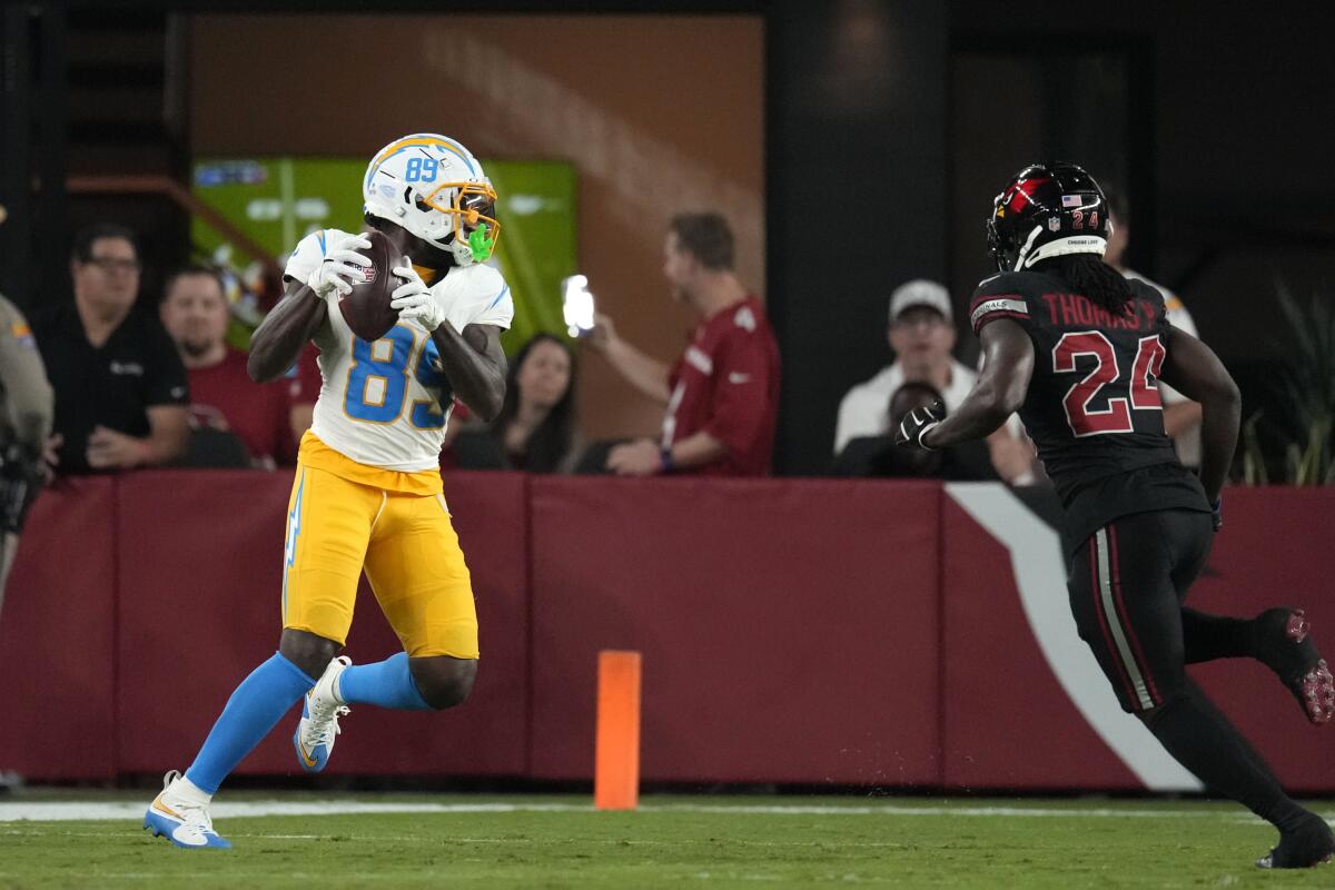 The Chargers' Jalen Reagor (89) catches a pass against the Cardinals before fumbling into the end zone for a touchback.