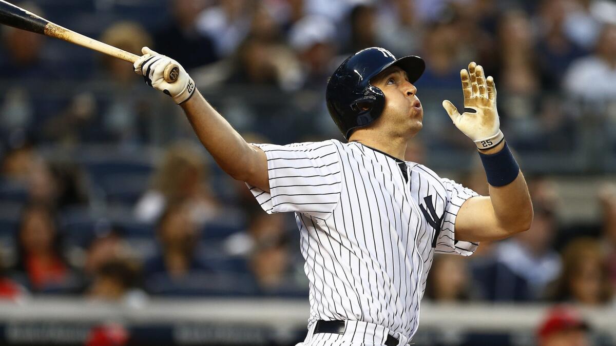 Yankees first baseman Mark Teixeira watches his two-run home run against the Angels in the third inning Friday night in New York.