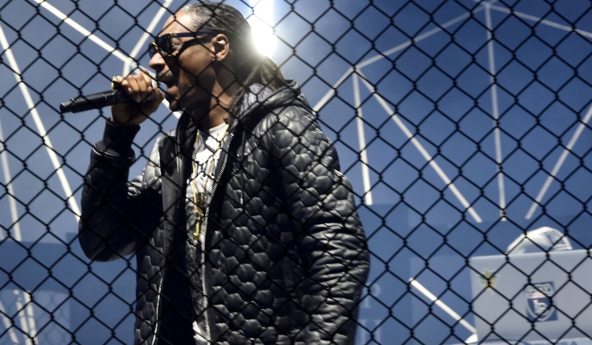 Snoop Dogg performs on the runway during the Philipp Plein Show in Milan, Italy.