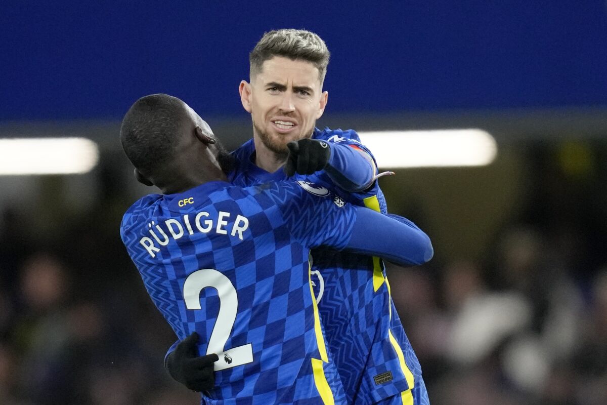 Chelsea's Jorginho celebrates with Antonio Rudiger, left, after scoring his side's first goal during the English Premier League soccer match between Chelsea and Manchester United at Stamford Bridge stadium in London, Sunday, Nov. 28, 2021. (AP Photo/Kirsty Wigglesworth)