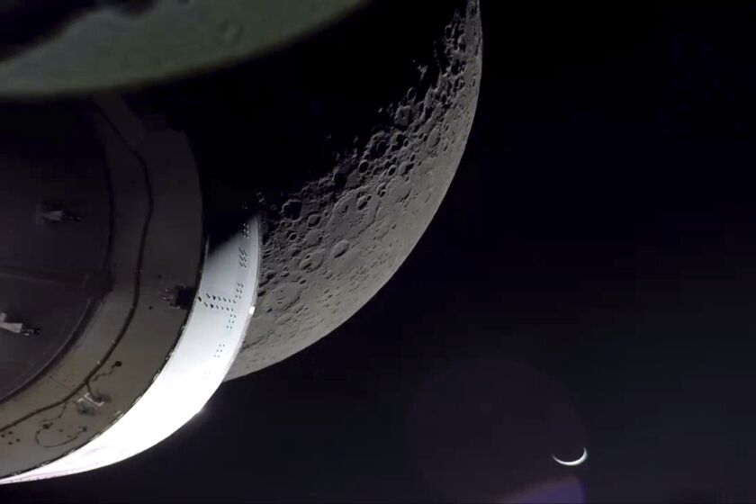 NASA's Orion spacecraft beamed back close-up photos of the moon and Earth on Monday, Dec. 5, 2022. The crew capsule and its test dummies will aim for a Pacific Ocean splashdown on Sunday, Dec. 11, 2022, off the coast of San Diego after a three-week test flight, setting the stage for astronauts on the next flight in a couple years. (NASA via AP)