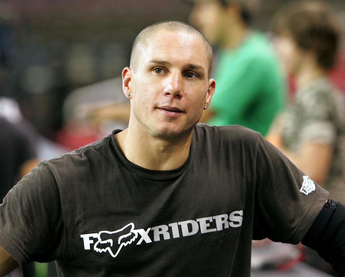 BMX rider Dave Mirra pauses during practice for the Panasonic Open event on June 9, 2005, in Louisville, Ky.