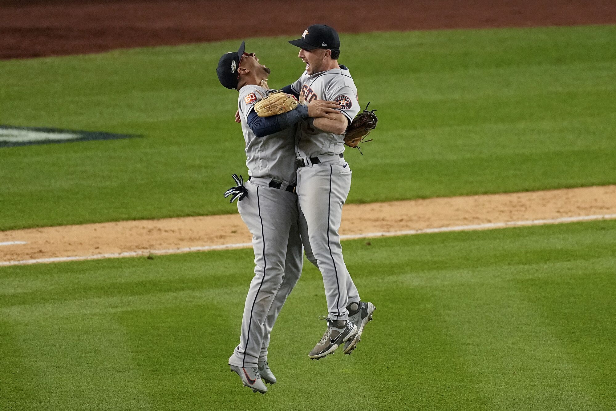 Houston third baseman Alex Bregman and first baseman Yuli Gurriel celebrate after the Astros defeated the New York Yankees