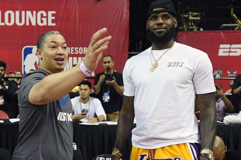 LAS VEGAS, NV - JULY 15: Head coach Tyronn Lue (L) of the Cleveland Cavaliers talks with LeBron James of the Los Angeles Lakers after a quarterfinal game of the 2018 NBA Summer League between the Lakers and the Detroit Pistons at the Thomas & Mack Center on July 15, 2018 in Las Vegas, Nevada. NOTE TO USER: User expressly acknowledges and agrees that, by downloading and or using this photograph, User is consenting to the terms and conditions of the Getty Images License Agreement. (Photo by Ethan Miller/Getty Images) ** OUTS - ELSENT, FPG, CM - OUTS * NM, PH, VA if sourced by CT, LA or MoD **