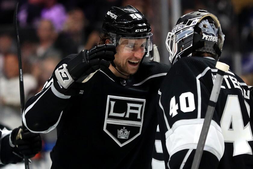 LOS ANGELES, CALIFORNIA - FEBRUARY 12: Kurtis MacDermid #56 of the Los Angeles Kings and Calvin Petersen #40 of the Los Angeles Kings celebrate after defeating the Calgary Flames 5-3 in a game at Staples Center on February 12, 2020 in Los Angeles, California. (Photo by Sean M. Haffey/Getty Images)