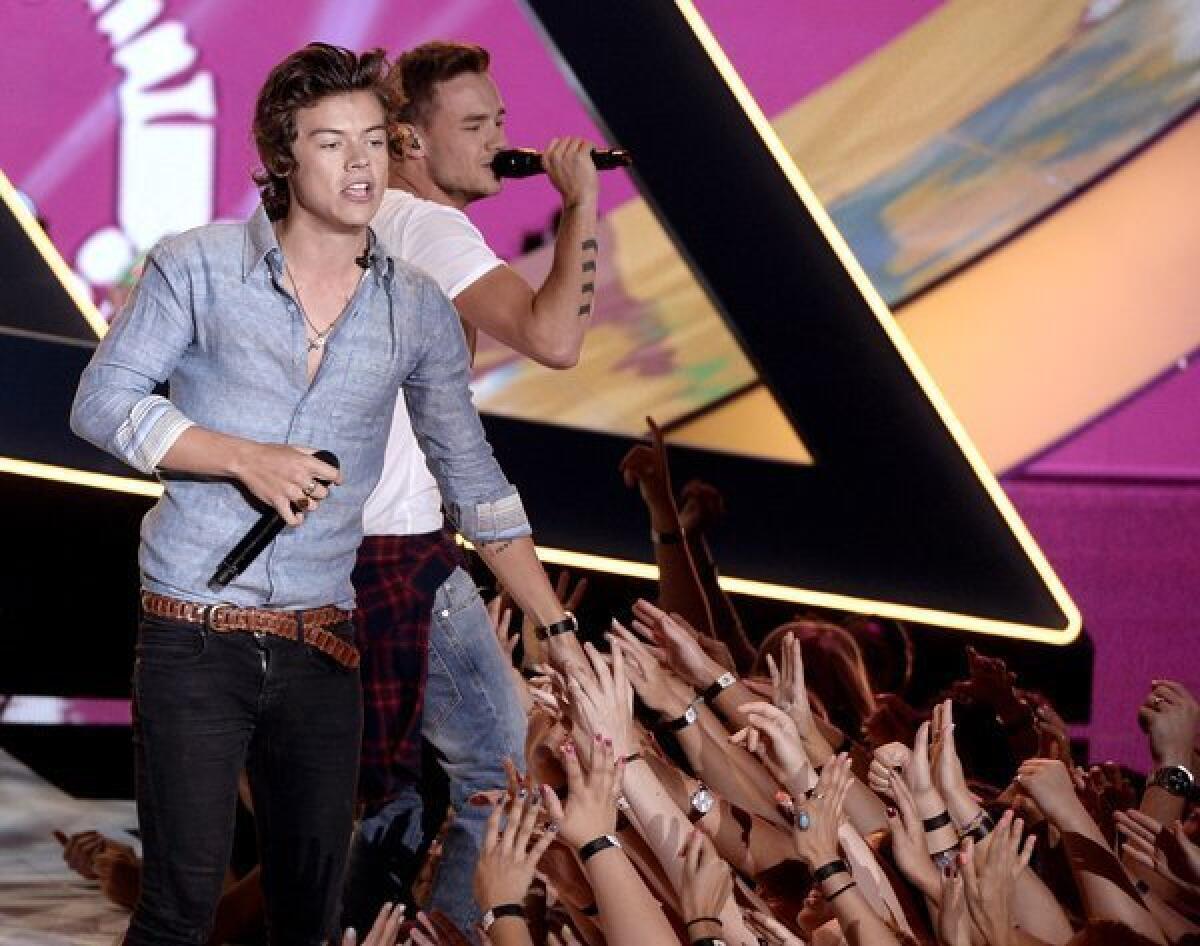 Singers Harry Styles, left, and Louis Tomlinson of One Direction perform at Sunday's "Teen Choice Awards" at the Gibson Amphitheatre.