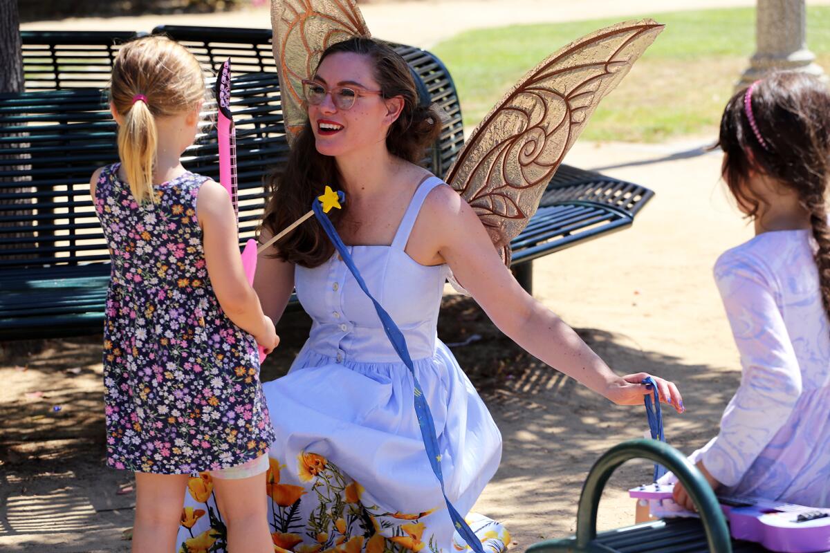 "Pixie" entertains children in her fairy tale world during ninth annual Day of Music Fullerton. 