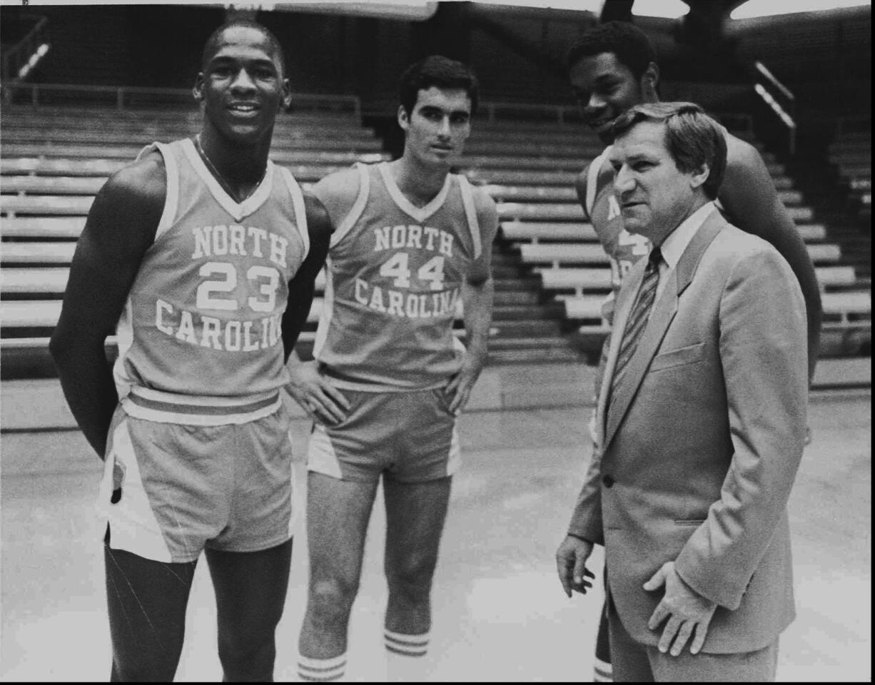 Michael Jordan, from left, Matt Doherty, Sam Perkins and North Carolina coach Dean Smith pose on Oct. 14, 1982.