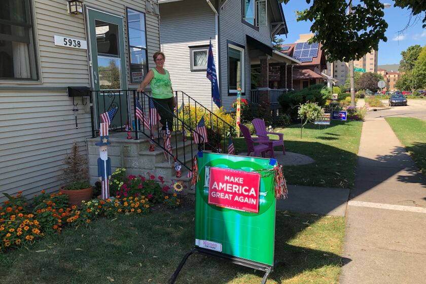 KENOSHA, WISCONSIN SEPTEMBER 3. 2020 - Mary Morgan initially posted her Trump sign and flag at the edge of her lawn, but moved it back at the request of her neighbors, "because we're friends." They maintained peace by avoiding political discussions. (Molly Hennessy-Fiske / Los Angeles Times)