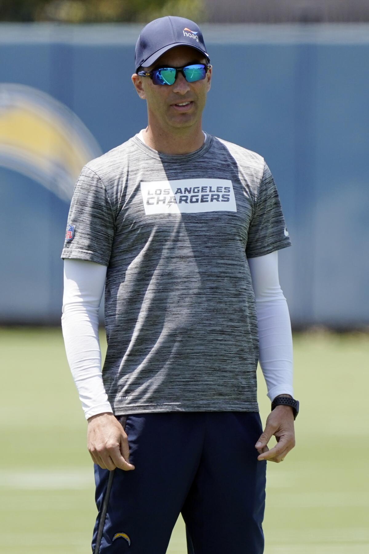  Chargers general manager Tom Telesco watches practice.