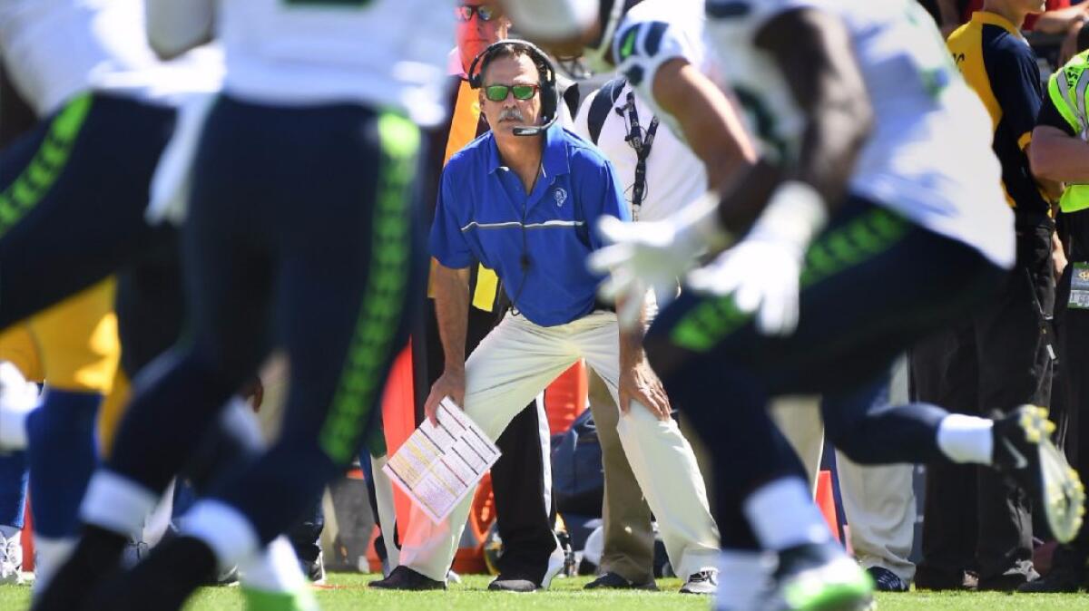Rams Coach Jeff Fisher watches the Seattle Seahawks run a play from the sideline during a game on Sept. 18.