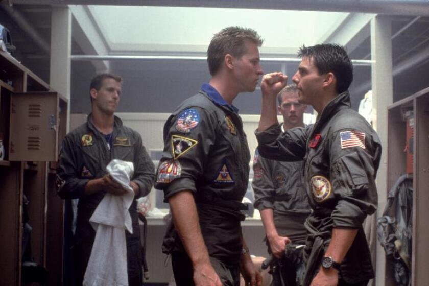 A scene from "Top Gun" in which Iceman (Val Kilmer, left) confronts Maverick (Tom Cruise).