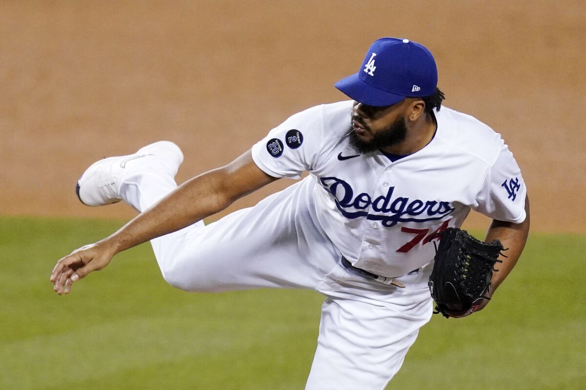 Dodgers relief pitcher Kenley Jansen delivers during the ninth inning of a 6-4 win over the Seattle Mariners.