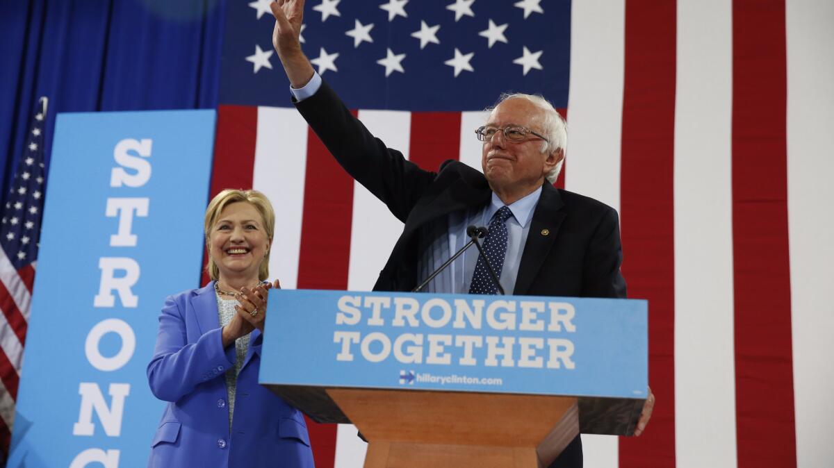 Sen. Bernie Sanders endorses Hillary Clinton for president at a rally in Portsmouth, N.H., on Tuesday.