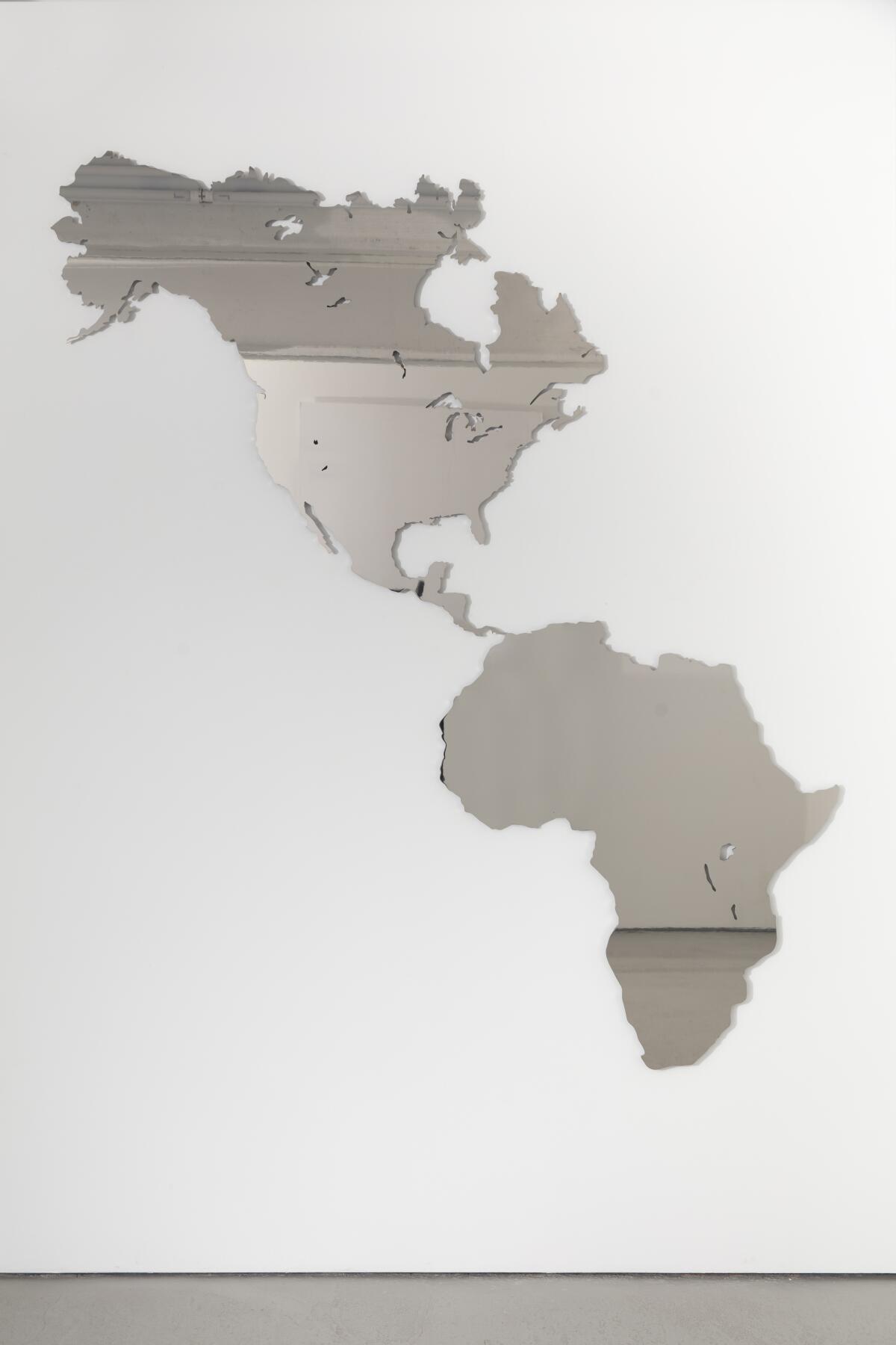A mirror shaped like the Americas and Africa