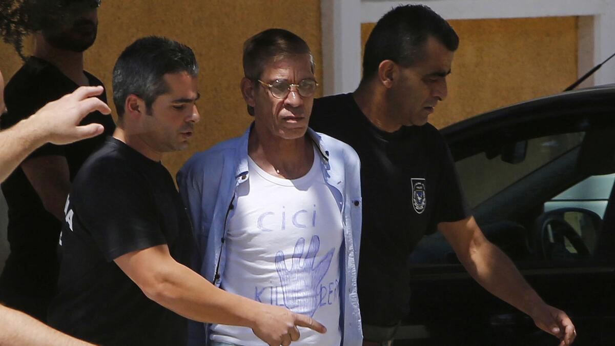 Seif Eddin Mustafa, center, arrives in a court in Nicosia, Cyprus, in April 2016. The Egyptian who said he hijacked an EgyptAir plane to protest his nation's government has been extradited back to his home country.