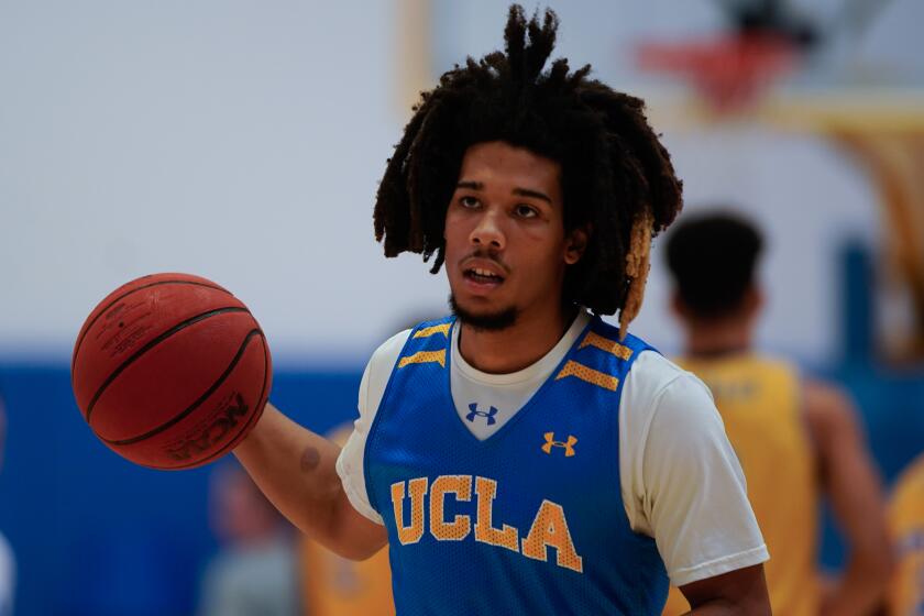Tyger Campbell dribbles during a UCLA practice at the Mo Ostrin Basketball Center on Oct. 10.