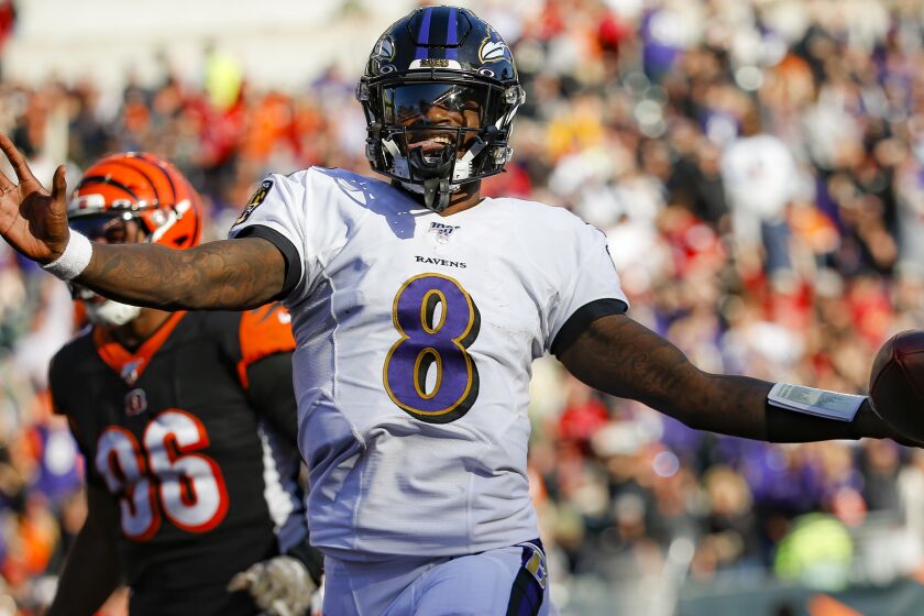 Baltimore Ravens quarterback Lamar Jackson scores a touchdown during the second half of NFL football game against the Cincinnati Bengals, Sunday, Nov. 10, 2019, in Cincinnati. (AP Photo/Frank Victores)