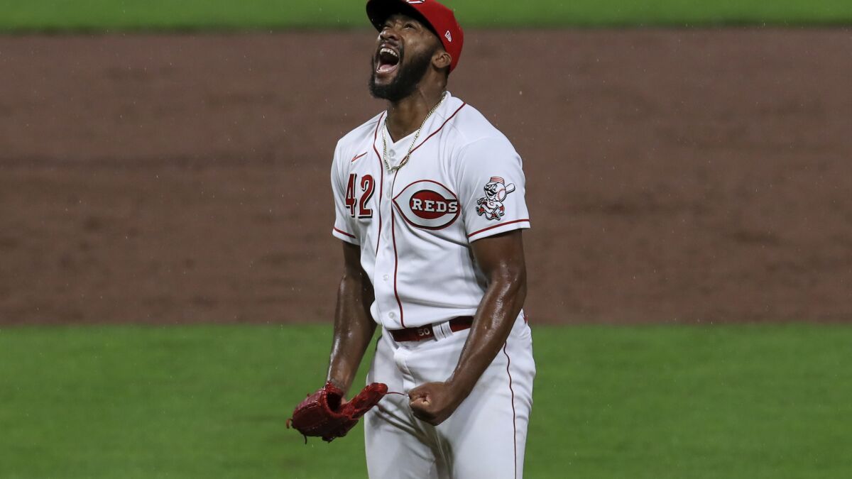 Suárez drives in 3 runs as Mahle, Reds beat Cubs 6-5 - The San