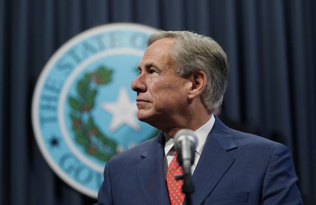 Texas Gov. Greg Abbott attends a news conference in 2020.