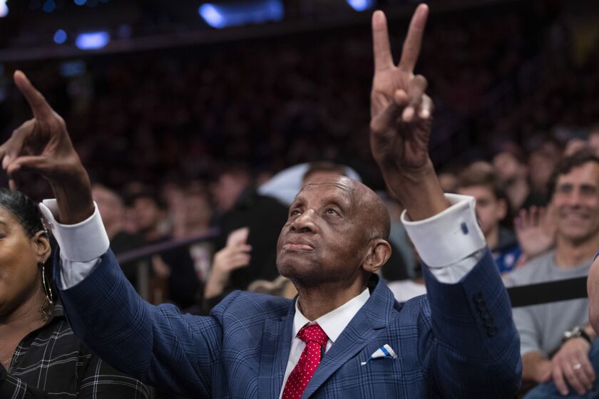 Hall of Fame inductee and former New York Knick Dick Barnett gestures during a timeout in the first half of the NBA basketball game between the Knicks and the Cleveland Cavaliers, Sunday, Nov. 10, 2019, at Madison Square Garden in New York. (AP Photo/Mary Altaffer)