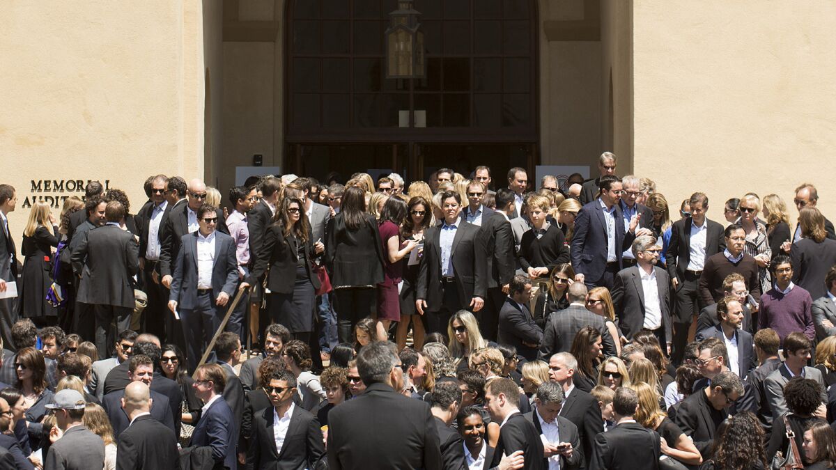 Mourners leave a memorial service for SurveyMonkey CEO David Goldberg at Stanford University.