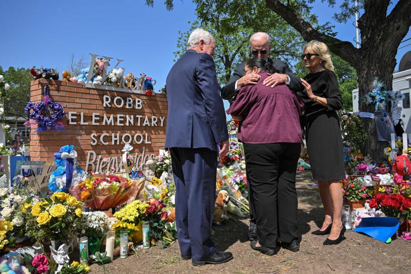 US President Joe Biden embraces Mandy Gutierrez, the Priciple of Robb Elementary School, as he and First Lady Jill Biden pay their in Uvalde, Texas on May 29, 2022. - Biden is heading to Uvalde, Texas to pay his respects following a school shooting. (Photo by MANDEL NGAN / AFP) (Photo by MANDEL NGAN/AFP via Getty Images)