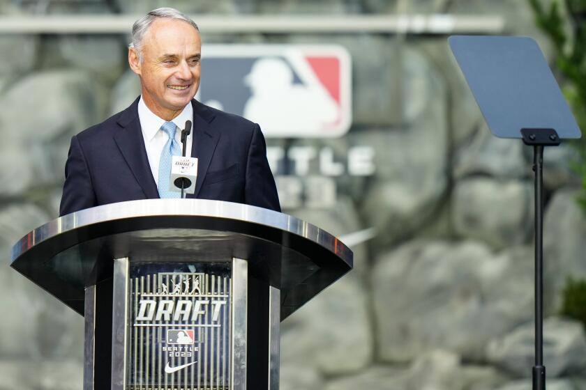 Major League Baseball Commissioner Rob Manfred takes part in the draft on July 9, 2023, in Seattle.