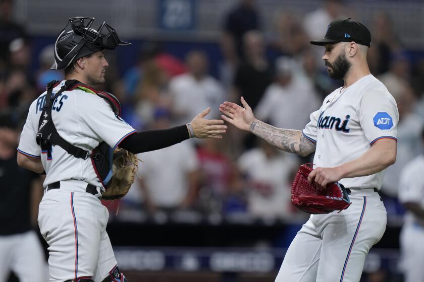 Gray pitches 6 innings as Rangers beat reeling Marlins 8-0