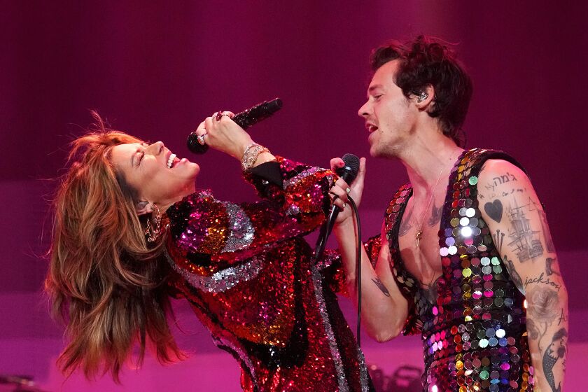 Shania Twain and Harry Styles perform onstage